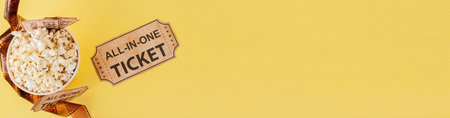 Movie tickets, film strips and popcorn on blue background. Copy space for text.