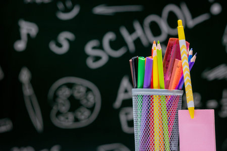 School background with stationery accessories. Books, globe, pencils and various office supplies...