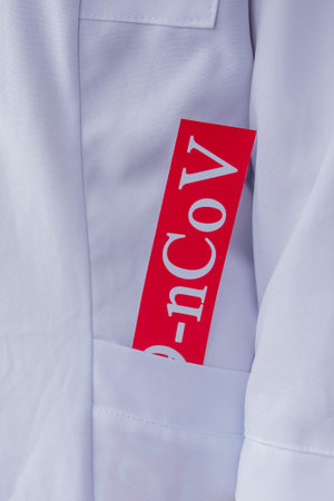 medical mask and inscription COVID-19 in Doctor's Pocket.