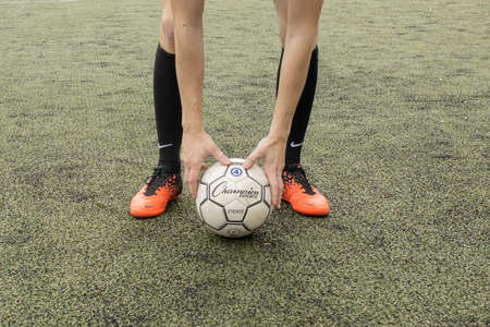 Kyiv, Ukraine - August 17, 2019 soccer ball with his feet on the football fieldのeditorial素材