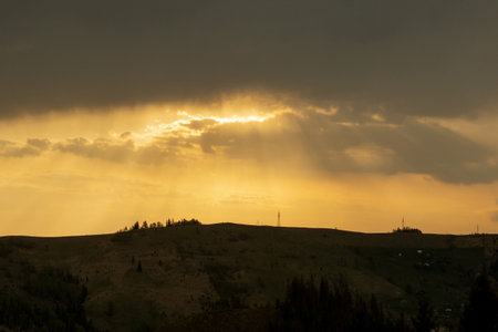 Beautiful sunset colors over the mountains of Carpathian, Ukraine, Europe. Sun setting after hot...