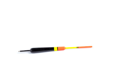 Fishing float with a long keel, for fishing rods on a white background, close-up.