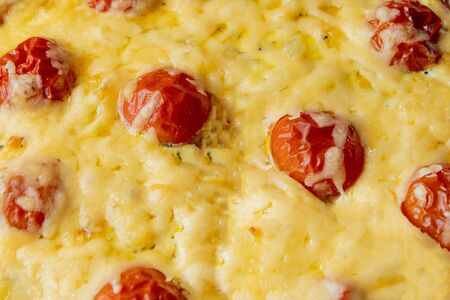 Homemade quiche lorraine with chicken, tomatoes and cheese. French cuisine. Selective focus. Top view. Copy space.の写真素材