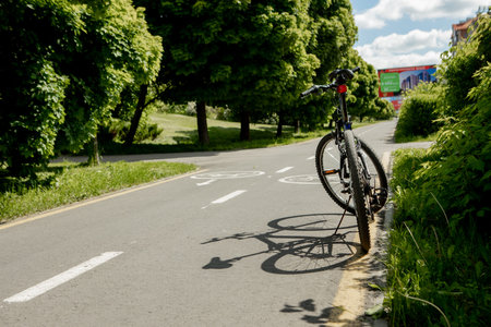 Bicycle on the roud on the background of Bicycle road sign and bike riders.