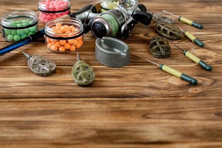 Accessories for carp fishing and fishing baits on wooden planks with copy space.の写真素材