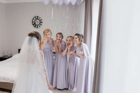 Ivano-Frankivsk, Ukraine, September 8 2019: Happy girls at their best friend's wedding. Beautiful and elegant bride with bridesmaids. Gorgeous bride with her girlfriends posing in the room.のeditorial素材