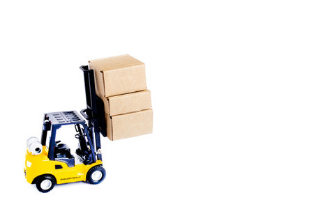 Mini forklift truck load cardboard boxes isolated on white background. Logistics and transportation...