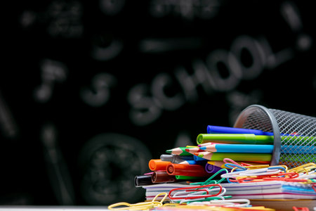School background with stationery accessories. Books, globe, pencils and various office supplies...