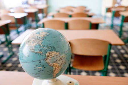 Earth globe model ball map with class room background. Concept for global international educaiton or communications, politics environmental for learning world wide. vintage toneの写真素材
