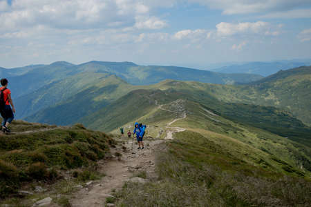 Hiker on the top in Carpathians mountains. Travel sport lifestyle concept.の写真素材