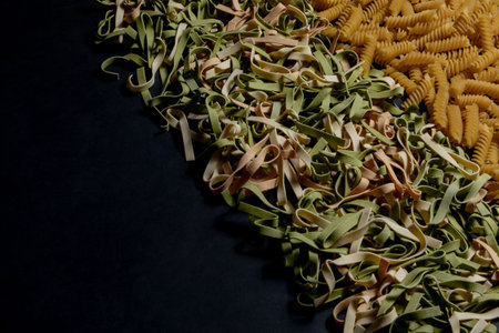 Variety of types and shapes of dry Italian pasta. Italian Macaroni raw food background or texture:...