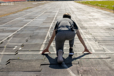 Track runners man boy running on stadium.