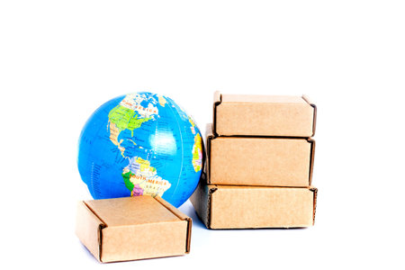 Earth globe is surrounded by boxes isolated on white background. Global business and international...