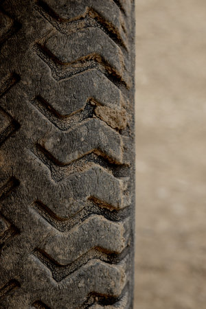 Detail of an old, cracked tractor tire.
