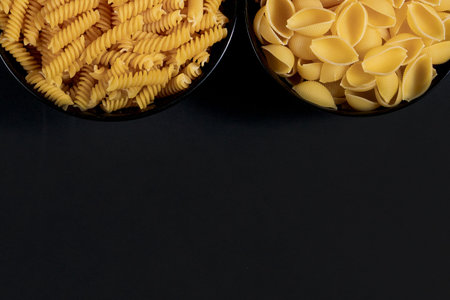 Various pasta. Cooking concept. Top view on dark beton background wuth copy spaceの写真素材