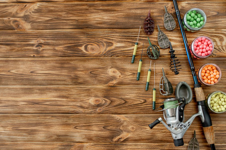 Accessories for carp fishing and fishing baits on wooden planks with copy space.の写真素材