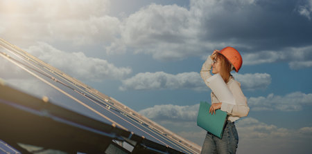 Businesswomen working on checking equipment at solar power plant with tablet checklist, woman...
