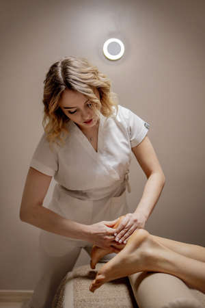 Acupressure, reflexology. Natural medicine, reflexology, acupressure foot massager oppresses energy flow points.の写真素材