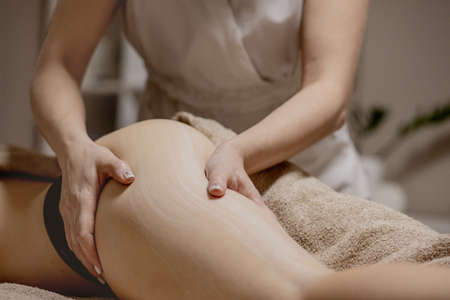 Legs and buttocks massage to reduce cellulite and phlebeurysm and preserve an healthy look. Skin and bodycare. Recovery.の写真素材