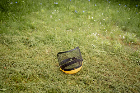 Protective helmet for the mower on cut grass.の写真素材