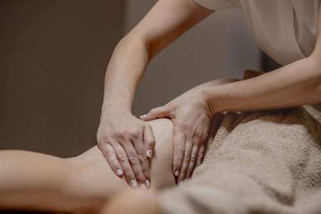 Close up of anti cellulite massage for young woman in wellness center. Problems of women body. Perfect skin fat burning beauty concept.の写真素材
