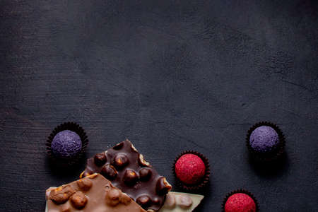 Chocolates background. Chocolate. Assortment of fine chocolates in white, dark, and milk chocolate. Praline Chocolate sweets.の写真素材