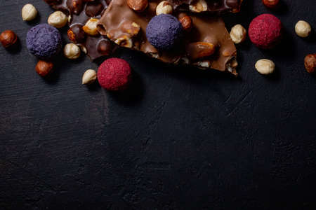 Chocolates background. Chocolate. Assortment of fine chocolates in white, dark, and milk chocolate. Praline Chocolate sweets.の写真素材