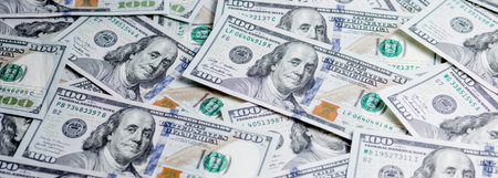 Pile of one hundred dollar bills new design.