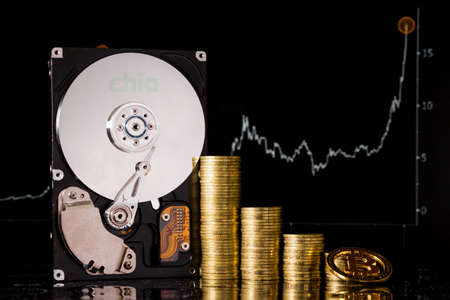 Cryptocurrency Chia and hard disk server for mining. New Crypto currency ChiaCoin virtual money concept on black background.の写真素材