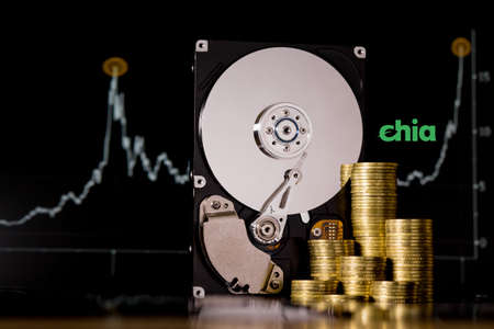 Cryptocurrency Chia and hard disk server for mining. New Crypto currency ChiaCoin virtual money concept on black background.の写真素材