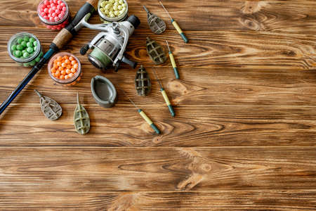 Accessories for carp fishing and fishing baits on wooden planks with copy spaceの写真素材