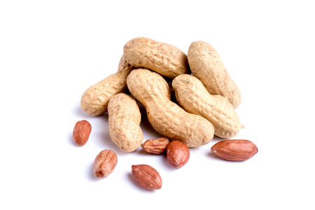 Peeled peanuts and peanut pod isolated on white background
