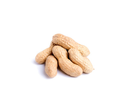 Peeled peanuts and peanut pod isolated on white background