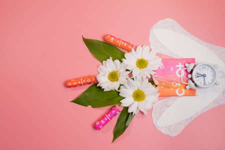 Womans comfort and hygienic protection, menstruation, sanitary pads on pink background. Critical days.Copy space.の写真素材