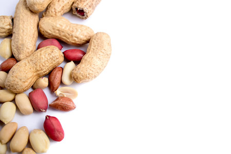 Peeled peanuts and peanut pod isolated on white background