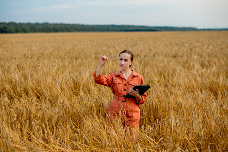 Agronomist holding test tube with barley grains in field, closeup. Cereal farming, oncept of wheat...