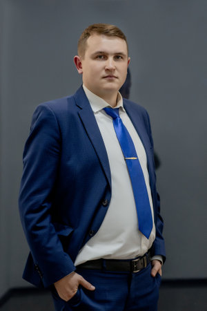 portrait of concentrated lawyer working at workplace with documents in officeの写真素材