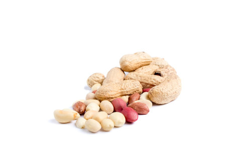 Peeled peanuts and peanut pod isolated on white background.