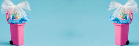 Earth globe lies in the trash. The globe lies in a heap of plastic. plastic pollution of nature. copy spaceの写真素材