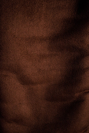 Background texture of dark brown fabric closeup. Brown canvas grunge background texture.