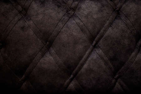 Quilted velor buttoned classic black color fabric wall pattern background. Elegant vintage luxury sofa upholstery. Interior plush backdrop.の写真素材