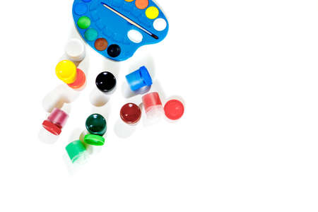 Jars with gouache multicolored paint, palette, brush. Top view.Flat lay.の写真素材