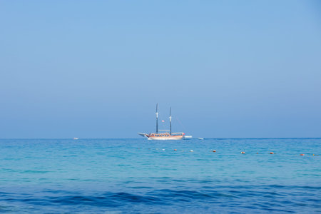 A cruise ship sailing on the sea. Travel by ferry. Sea cruise on a ship. Blue seascape with ship....