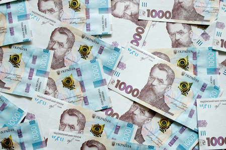 Background 1000 hryvnias. Money texture. Many Ukrainian hryvnias. Ukrainian banknote with Volodymyr Vernadskyの写真素材