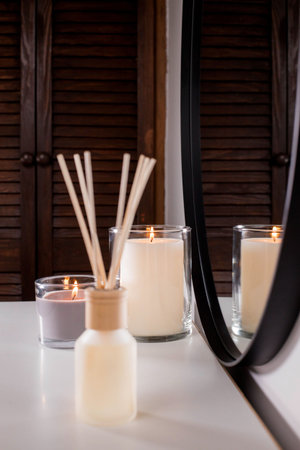 Aroma diffuser and scented candles that create coziness in the house. romantic atmosphere. Details...