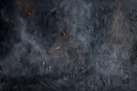 Abstract black textured background with scratches.