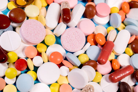 Background with the many colorful capsules and pills. The concept of medical treatment.