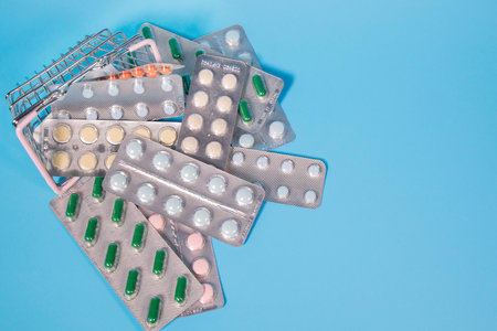 A bunch of pills in a blister pack. Blisters with colorful pills. Pharmaceutical blister packaging. The concept of buying pills.の写真素材