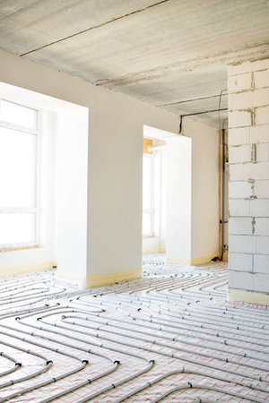 Installation of underfloor heating pipes for water heating. heating systems. Pipes for underfloor heatingの写真素材