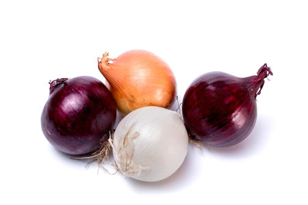 Different varieties of onions, red, white, golden isolated on a white background. view from above.の写真素材